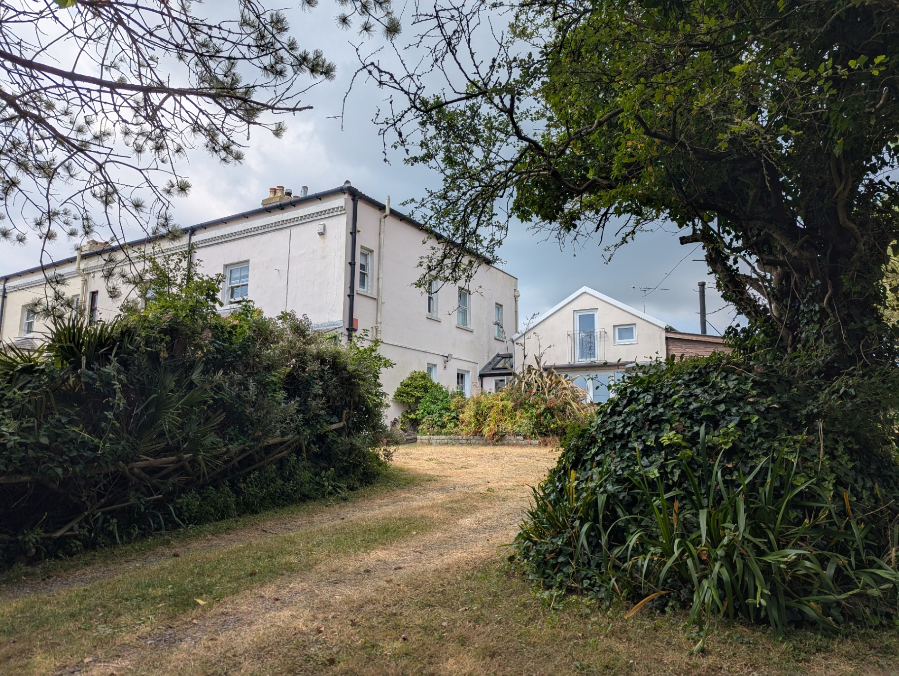 Looking up the driveway to the main house, with the boathouse to the right.